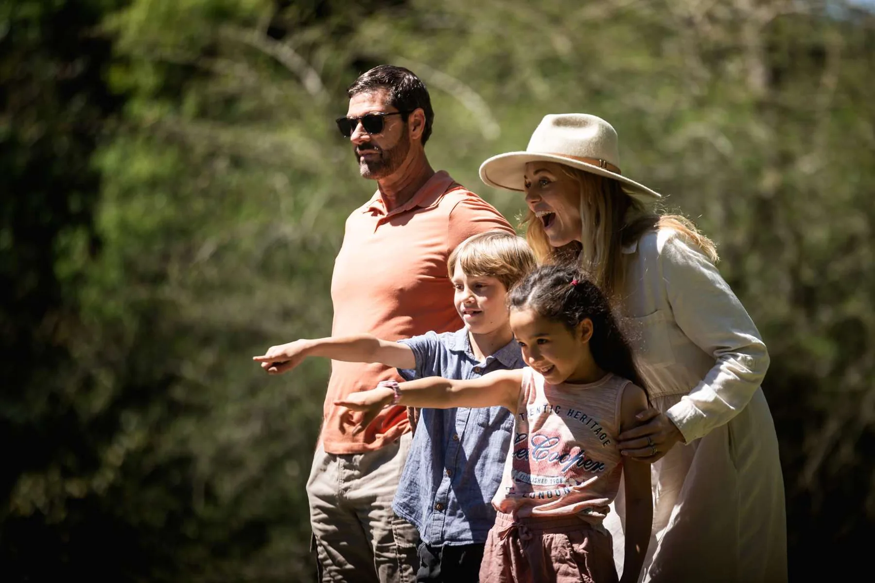 Family together at a bush campsite