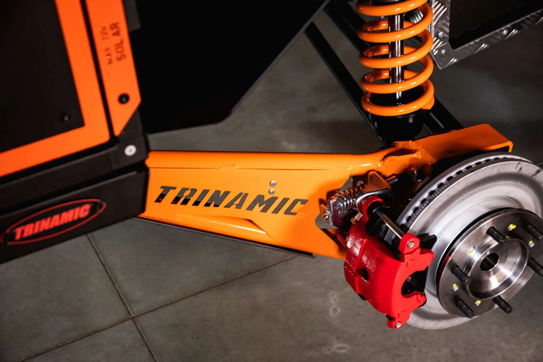 Trinamic Core suspension arm, coilover shock and disc brake on the Gen3 X1